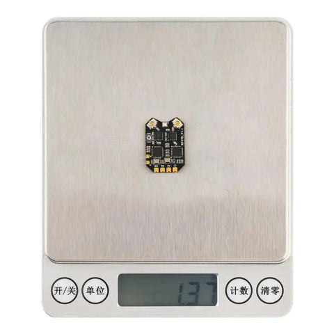 RadioMaster RP4TD ELRS Diversity FPV Receiver 2.4GHz ExpressLRS Nano RX Module on a digital scale displaying weight