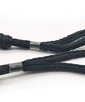 Close-up of black Shock Absorbing Bungee Dock Line For Boats, 4 Ft Black, 4 Pack, showing easy loop and slider ends for quick mooring.