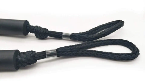 Close-up of black Shock Absorbing Bungee Dock Line For Boats, 4 Ft Black, 4 Pack, showing easy loop and slider ends for quick mooring.