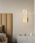Super Tight 16W Gold LED Wall Sconce With Dimmable Rectangle Frame And Switchable Warm Natural White Glow To Honestly Level Up Your Bedroom Or Living Room Setup With Zero Fuss At All mounted above a modern bed.