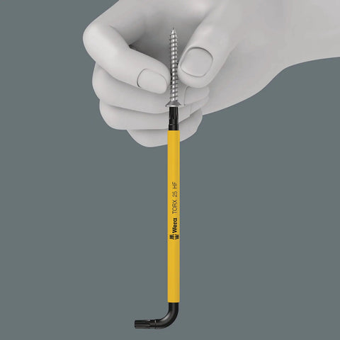 Hand holding Torx L Key Set 9 Piece With Holding Function For Recessed Torx Screws Black Laser Coated for corrosion protection.