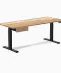 Ergonomic Premium Solid White Oak Standing Desk With Sleek Integrated Drawer And Seamless Height Adjustment For Zero Hassle Workflows And Rock Solid Comfort, side view showcasing oak surface and black legs.