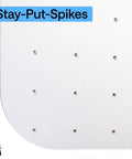 Close-up of Slip Resistant Clear Office Chair Mat For Carpet Floors With Smooth Rolling Glide showing underside spikes.