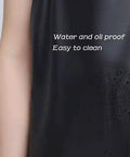 Close-up of black waterproof rubber vinyl long work apron showing water-resistant feature and text "Water and oil proof."