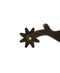 Close-up of 8 point rowel on antiqued finish all purpose men's spur with 2 inch shank for trail training pleasure riding.