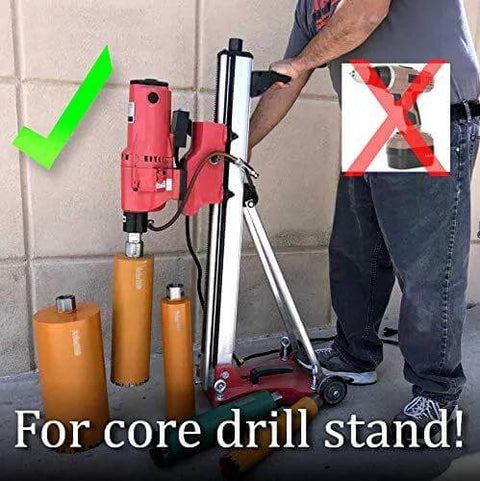 Side view of red core drill mounted on a portable wheeled stand with three orange core bits nearby.