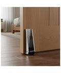 Heavy Duty 2 Pack Low Profile Anti Sag Gate Support Rollers With Sealed Ball Bearings installed on wooden door, providing support on hardwood floor.