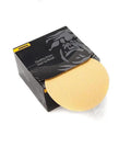 Box of Gold Adhesive Sanding Discs 5 Inch No Hole PSA Grit 100, single disc partly pulled out, for orbital sanders.