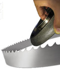 Hand holding Five Inch CBN Bandsaw Grinding Wheel for Seven Eighths Inch Tooth Spacing Blades Ten and Thirty Degree Tooth Pitch