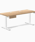 Flex Your 60 Inch Workspace With This Dual Motor Electric Standing Desk Crafted From Solid White Oak Featuring A Hidden Storage Drawer And Sleek White Frame, side view with oak top and white legs.