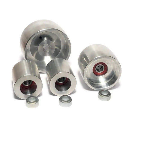 Professional Belt Grinder Wheel Set Engineered For Serious Knife Making Featuring A Gnarly 4 Inch Drive Wheel Paired With A Slick 2 Inch Idler And 5/8 Inch Bore Setup in aluminum.