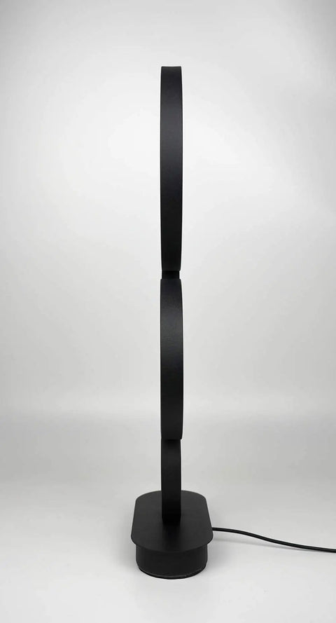 Side view of Four Circle Dimmable LED Table Lamp with Color Adjustable Light showing modern round design and black finish
