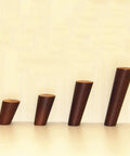 Solid Wood Table Legs Set Of 4 Round Conical Desk Feet Dark Walnut Finish viewed from the side on a plain background.
