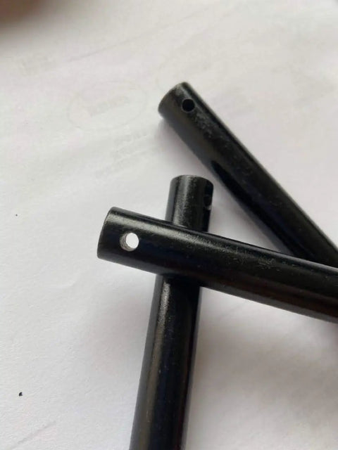 Close-up of Ten Pack Magnesium Fire Starter Rods For Camping And Survival No Fuss Ferrocerium Flint Lighters 80mm By 8mm with hole.