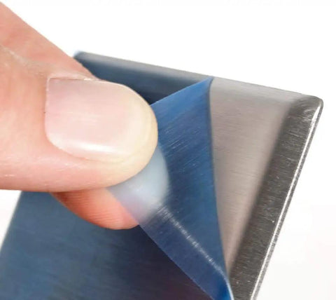 Peeling blue film from Stainless Steel 1 Gang Decora Wall Plate With GFCI Device Mount Slick Look Smooth Face And Rounded Edges