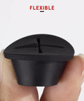 Premium Flexible Silicone Cable Cord Grommet Set 1 Inch Black shown held between fingers for desk hole cover and wire pass through.