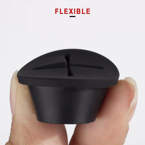 Premium Flexible Silicone Cable Cord Grommet Set 1 Inch Black shown held between fingers for desk hole cover and wire pass through.