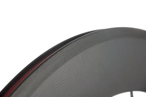 Close-up of Race Ready Carbon Road Wheelset 88mm Deep Clincher 700c With 23mm Width Fits Shimano Cassettes Matte 3K Finish Toray T700 Rim