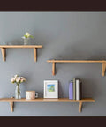 Heavy Duty L Shaped Corner Brackets For Walls Rock Solid Shelf Supports holding wooden shelves with decorative items.