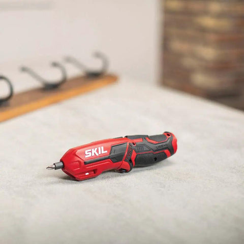 Pivot Grip 4V Rechargeable Cordless Screwdriver With 9 Bits, Bit Holder, and USB Charger on a surface