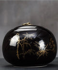 Top Shelf Vintage Black Ceramic Tea Storage Jar With Copper Pull Ring And Solid Airtight Seal For Coffee Beans Spices Candies Snacks And Everyday Kitchen Decor featuring bamboo and bird gold accents.