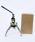 Thinking Process: hydraulic bearing puller kit with steel jaws, hand pump, and box for workshop use