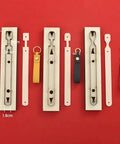 Three Piece Long Keychain Cutting Mold Set With Dog Paw Pattern Punch Tool for DIY Leathercraft, shown with key fob straps.
