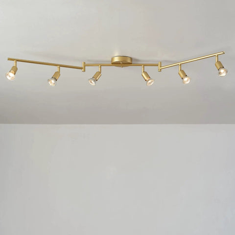 Payton 6-Light Foldable Track Lighting In Painted Brass With Exposed Sockets displayed in straight layout against white ceiling.