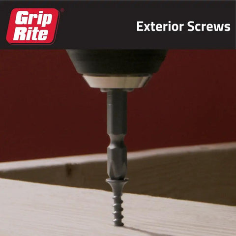 Heavy Duty Exterior Deck Screws For Pressure Treated Lumber Phillips Bugle Head Coarse Thread 1 1/4 In By 9 Gauge PrimeGuard Rust Resistant Finish One Pound Box Pack being driven into wood.