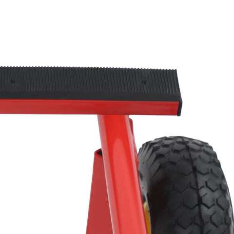 Close-up of Heavy Duty Furniture Moving Cart With Smooth Rolling Inflatable Tires And Tough Steel Frame, showing rubber foot and wheel.
