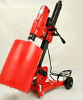Badass 12 Inch Concrete Core Drill Rig With 12 Piece Pro Series Diamond Wet Core Bit Set 1 To 12 Inches shown at an angle.