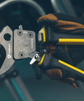 Gloved hand holding Ratcheting Cable Cutter With Two Step Mechanism For Clean Copper And Aluminum Cuts Up To 600 MCM
