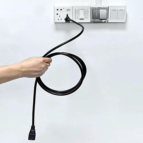 Hand holding black Outdoor Extension Cord 10 Ft Heavy Duty 3 Prong Waterproof Cord UL Listed Black for Indoor and Outdoor Use