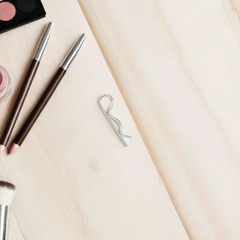 Top Notch Stainless Steel Cotter Pins For Heavy Duty Industrial Hitch Assembly And Secure Mechanical Connections With Durable R Shape Wire Lock Fasteners on wooden surface.
