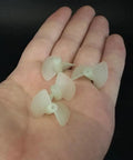 Hand holding Ten Pairs Nylon RC Boat Propellers, Two Blade CW CCW Set For RC Boats And Ships, Fits 1.95mm Hole And 2mm Shafts, 22mm Dia.