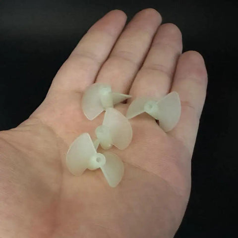 Hand holding Ten Pairs Nylon RC Boat Propellers, Two Blade CW CCW Set For RC Boats And Ships, Fits 1.95mm Hole And 2mm Shafts, 22mm Dia.