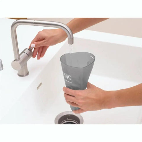 Person rinsing filter of Cordless Handheld Vacuum For Cars And Home Fast Clean, 2Ah Battery, Icy Blue over sink