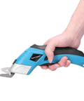 Cordless Electric Scissors With Knockout Power For Zero Fuss Fabric Cutting And Cardboard Trimming Featuring Dual Angle Blades held in hand.