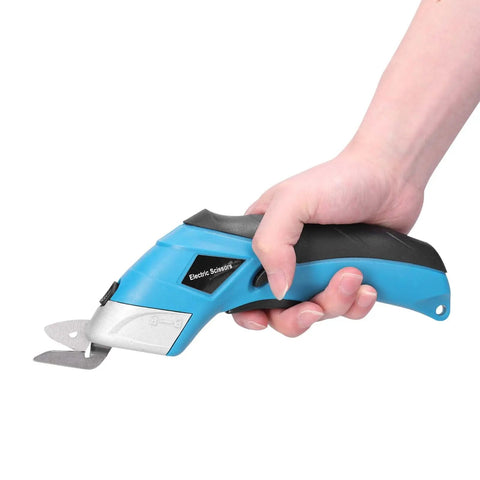 Cordless Electric Scissors With Knockout Power For Zero Fuss Fabric Cutting And Cardboard Trimming Featuring Dual Angle Blades held in hand.