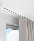 Commercial Grade Sliding Barn Door Hardware Kit Delivering Flawless Glide Aluminum Ceiling Track with gray curtains.