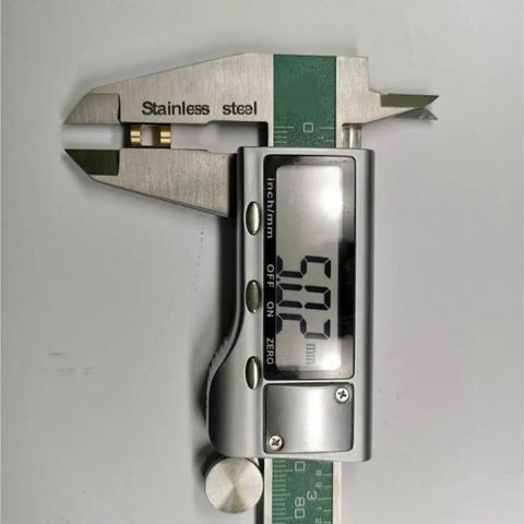 Digital caliper measuring 60.02mm, made of stainless steel for precise measurements in mechanical projects.