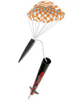 Journey Rocket Building Kit For Beginners With Launch Pad And Controller, rocket mid-flight with orange parachute deployed.
