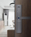 Knockout Biometric Fingerprint Door Lock With Slick Touch Screen Passcode Keyless Entry crafted from durable stainless steel gray body on a wooden door.