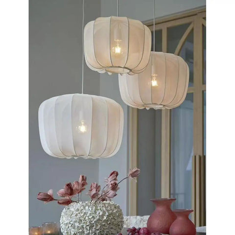 Nordic Apartment Pendant Light Cozy Handmade White Fabric Lantern Ceiling Hanging Lamp Minimalist Chandelier Imitation Silk Lampshade Modern Hanging Light With E26 Base For Dining Room Kitchen Cafe Restaurant over a table with flowers.