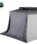 Hella Rugged Partner Side Awning Wall To Keep Your Trail Campout Rig Shade Covered features granite gray and lime green accents.