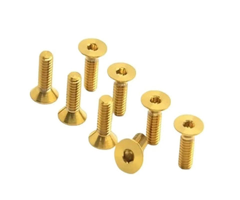 Pro Level M3 Gr5 Titanium Alloy Flat Countersunk Hex Socket Set Screws Coated In Durable Rainbow Finish For Snug Fits And Rapid Project Buildouts On Any Rig Or Machine Setup. Gold screws with countersunk heads in a group.