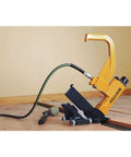 Flooring Nailer Rolling Base with Tool Free Thickness Adjustment from One Half to Three Quarters Inch in use on wood floor.