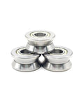 Two Piece V Groove Linear Bearing Replacement With Precision Steel Rollers For Frictionless Shaft Guidance And Steady Rotation In Automation Gear Sized At Twelve By Thirty Nine Point Nine By Eighteen Millimeters stacked view of steel rollers.