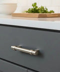 Satin Nickel Contemporary Bar Cabinet Handle Pull on dark cabinet with 3.5 inch hole centers, 3.5 inch centers, solid steel construction.