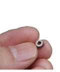 0.3 Module Planetary Gearbox Gear, 5.95mm Diameter, 2.55mm Inner Hole Bore, 18 Teeth held between fingers